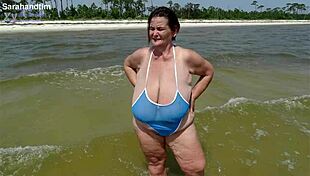 imagine plump granny's huge saggy tits breaking out on beach close up