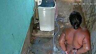 hidden cam catches stepmom bathing and flashing huge tits in backyard shower