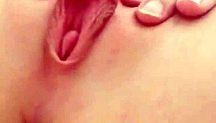 cute teen blonde spreads her tight pink pussy lips wide open