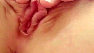 cute teen blonde spreads her tight pink pussy lips wide open