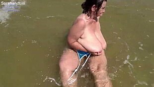 imagine plump granny's huge saggy tits breaking out on beach close up