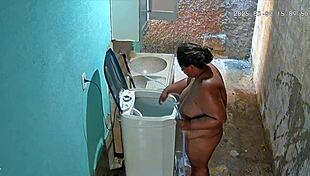 hidden cam catches stepmom bathing and flashing huge tits in backyard shower