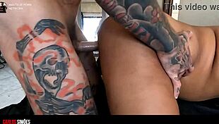 tattooed hunk gives young brunette a cock treat at home