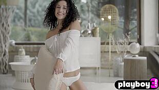 This curly babe strips naked showing her amazing milf curves