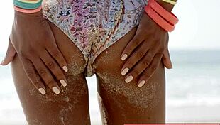 hey check out this sexy beach hottie in her bikini turning heads