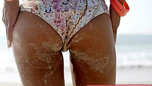 hey check out this sexy beach hottie in her bikini turning heads