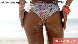 hey check out this sexy beach hottie in her bikini turning heads