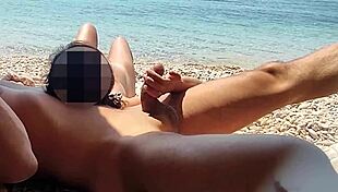 teacher strokes my huge cock on beach while girl spies and watches us cum.