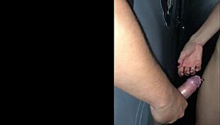 gf sneaks cock through glory hole at wild red club party