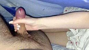 stepsister strokes cock under blanket then rides in dorm bedroom