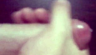 Huge cocked babe strokes massive dick exploding in enormous cumshot all over her tits