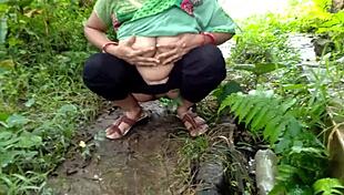 aunty pees outside then gets fucked in open jungle spot