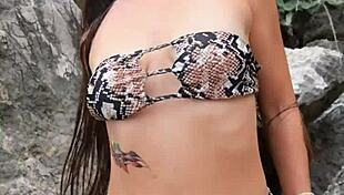 Hottie in sexy bikini flashes her cute petite boobs on the beach