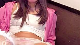 Crossdressing ladyboy masturbates pussy with net on crotch closeup