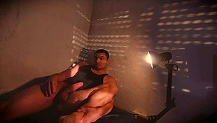 muscular bodybuilder strokes monster cock intimately as sunset shadows dance sexily on bed
