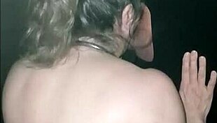 female slave sucks gloryhole cock hard