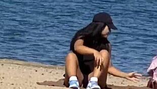 Juicy Asian teases beach cameltoe hidden!