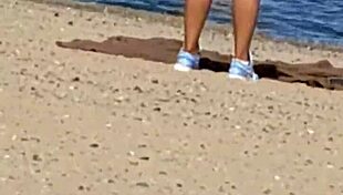 Juicy Asian teases beach cameltoe hidden!