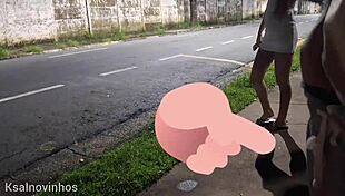 Redhead gets risky handjob at crowded bus stop