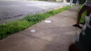 Redhead gets risky handjob at crowded bus stop