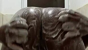 Horny guy strokes huge cock in steamy shower solo