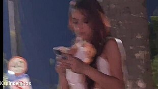 Redhead gets risky handjob at crowded bus stop