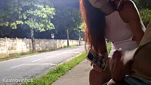 Redhead gets risky handjob at crowded bus stop