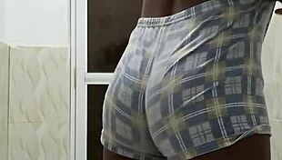 Horny guy strokes huge cock in steamy shower solo