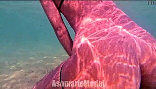 Skinny Latina babe flashes hairy pussy and small natural tits while swimming naked in pool slow motion