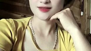 vietnamese girl sways seductively to thumping music beats in steamy club vibe