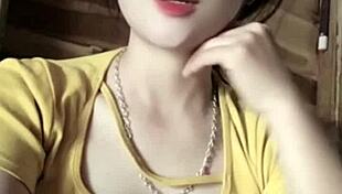 vietnamese girl sways seductively to thumping music beats in steamy club vibe