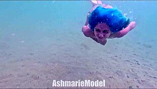 Skinny Latina babe flashes hairy pussy and small natural tits while swimming naked in pool slow motion