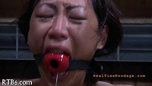 Hung up chick endures intense garage punishment session