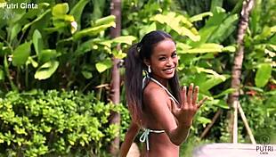 putri cinta splashes playfully in paddling pool footage