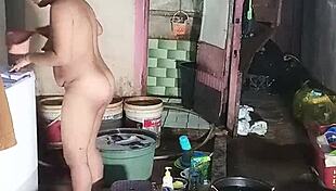 oh damn, this indonesian housewife washes clothes while fingering her hairy pussy wet!