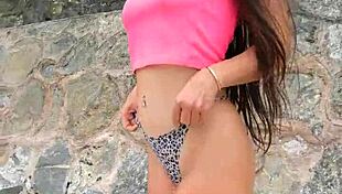 cute brunette babe flashes bikini teases dances sexy on crowded public beach