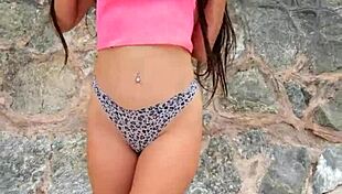 cute brunette babe flashes bikini teases dances sexy on crowded public beach