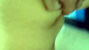 she slips into the bath, tracing her big tattooed tits seductively