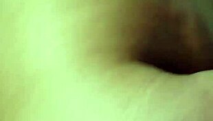 she slips into the bath, tracing her big tattooed tits seductively