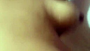 she slips into the bath, tracing her big tattooed tits seductively