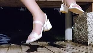 Tingxuan jerks off barefoot in heels and cums on her feet outdoors