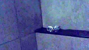 asian wife slut dildos her pussy in gym shower... watch her vibe those big nipples