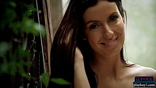 A busty brunette milf undresses slowly revealing huge softcore tits