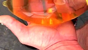 piss filled condom overflows outdoors