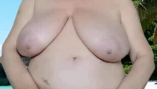 hot granny teases huge tits in skimpy bikini