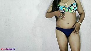 Electric thrill surges as Indian shemale in blue bikini crossdresses teasing huge tits and cock