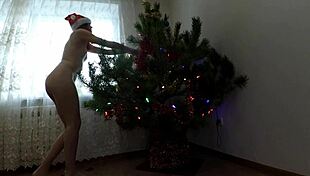 Bitch DANCES her PUSSY around Christmas tree teasing small tits