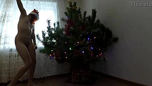 Bitch DANCES her PUSSY around Christmas tree teasing small tits