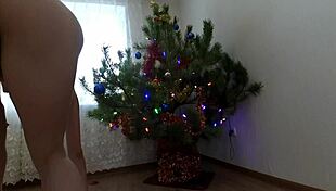 Bitch DANCES her PUSSY around Christmas tree teasing small tits
