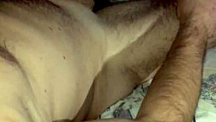 She jerks huge cock to cum explosion swapping loads in bedroom.